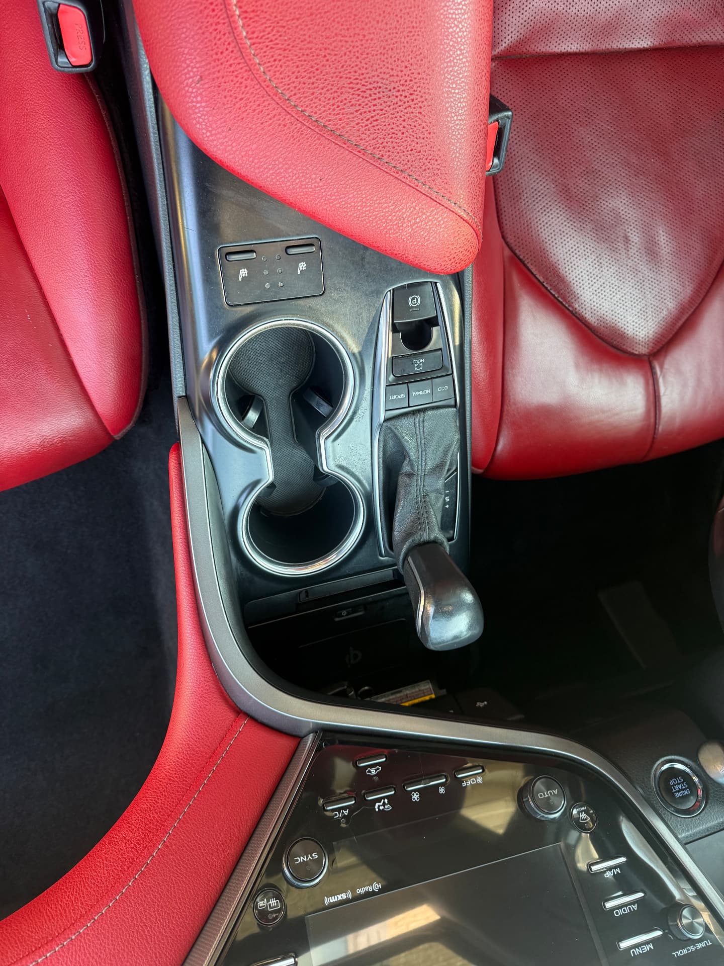 Clean Toyota Camry center console, shifter and cup holders after Miller's Detailing interior detail